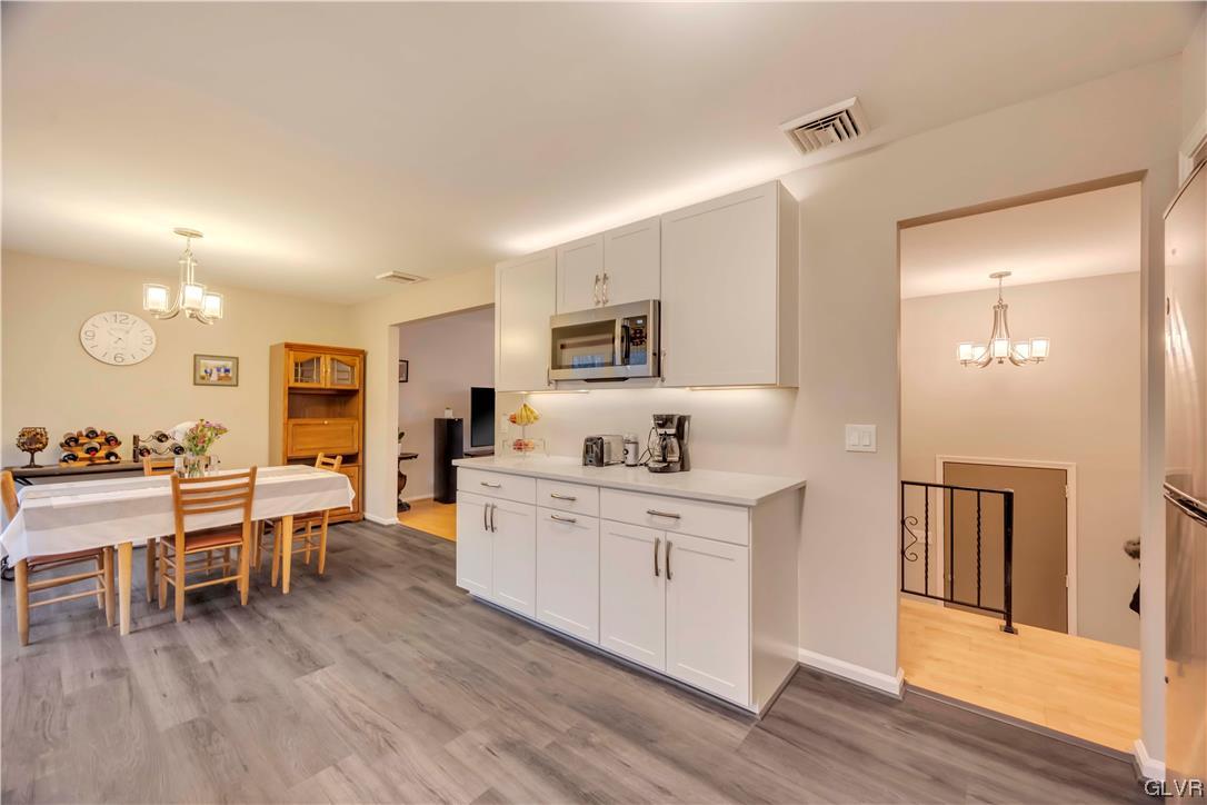 2559 Mountain Road Slatington, PA 18080 - Photo 6 of 32 a large white kitchen with wooden floor