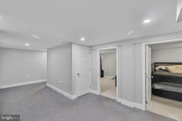 a view of hallway with a bedroom