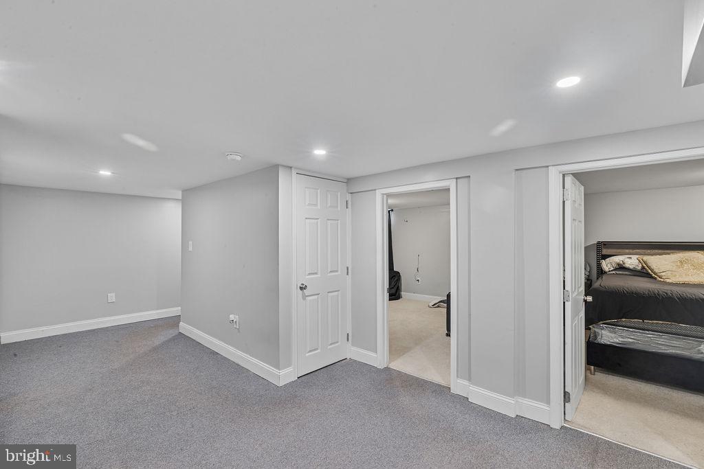 8489 Arbutus Road Pasadena, MD 21122 - Photo 16 of 41 a view of hallway with a bedroom