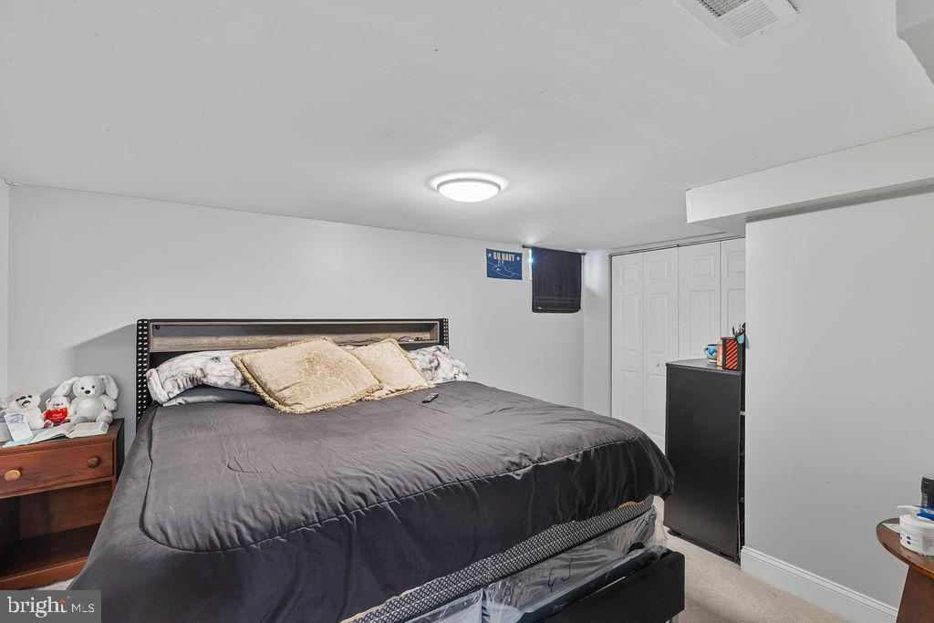 8489 Arbutus Road Pasadena, MD 21122 - Photo 27 of 41 a bedroom with a bed and a window