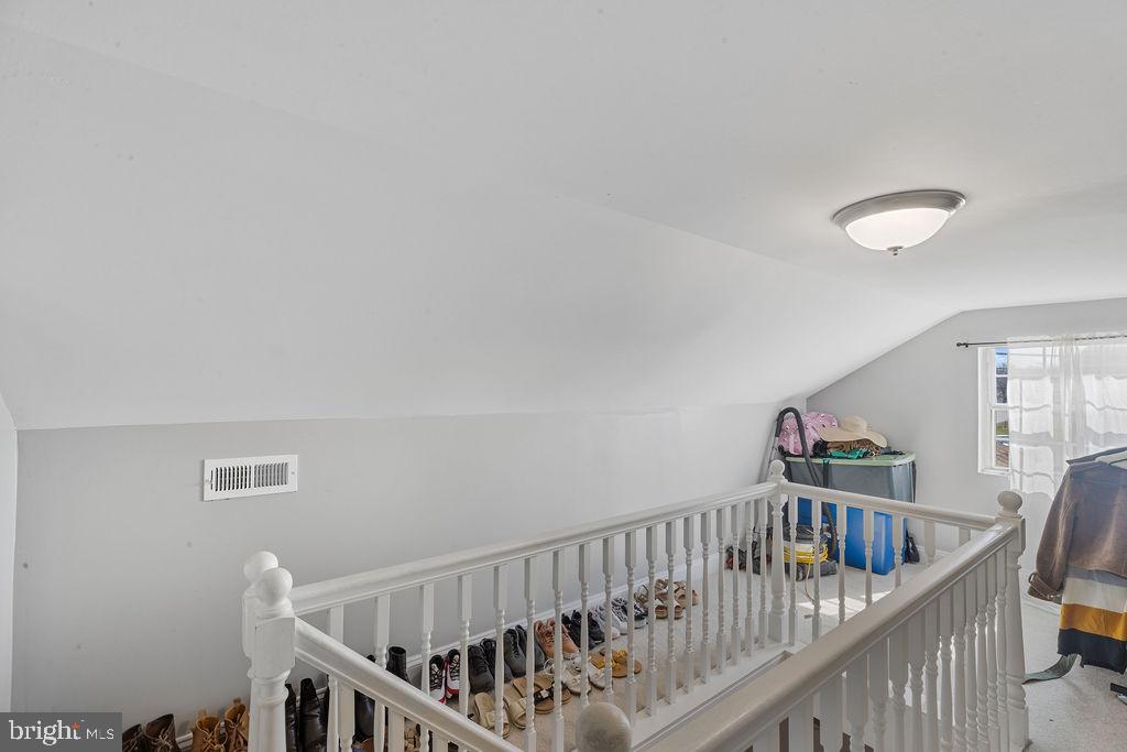 8489 Arbutus Road Pasadena, MD 21122 - Photo 32 of 41 a view of staircase with railing and white walls