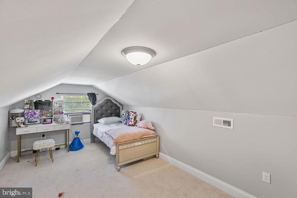 8489 Arbutus Road Pasadena, MD 21122 - Photo 33 of 41 a bedroom with furniture and a window