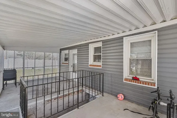 a view of a backyard with a tree