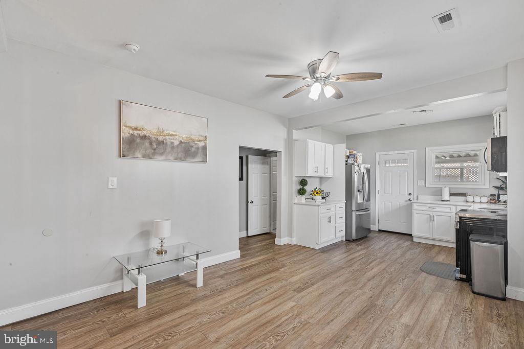 8489 Arbutus Road Pasadena, MD 21122 - Photo 9 of 41 a view of a livingroom with furniture and a ceiling fan