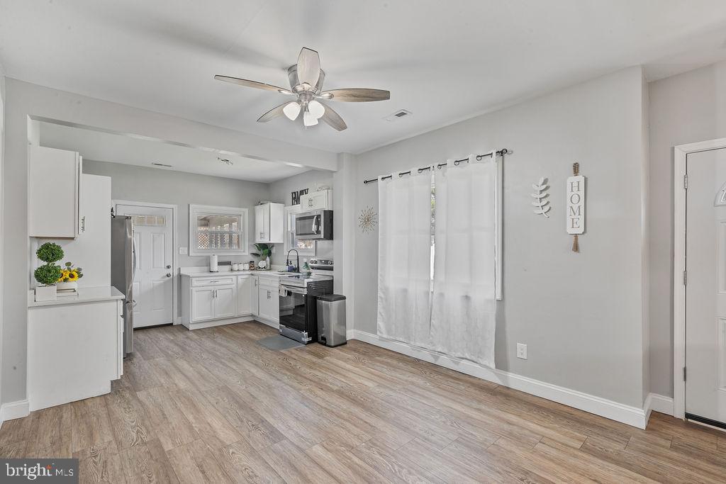 8489 Arbutus Road Pasadena, MD 21122 - Photo 10 of 41 a view of a kitchen with electric appliances