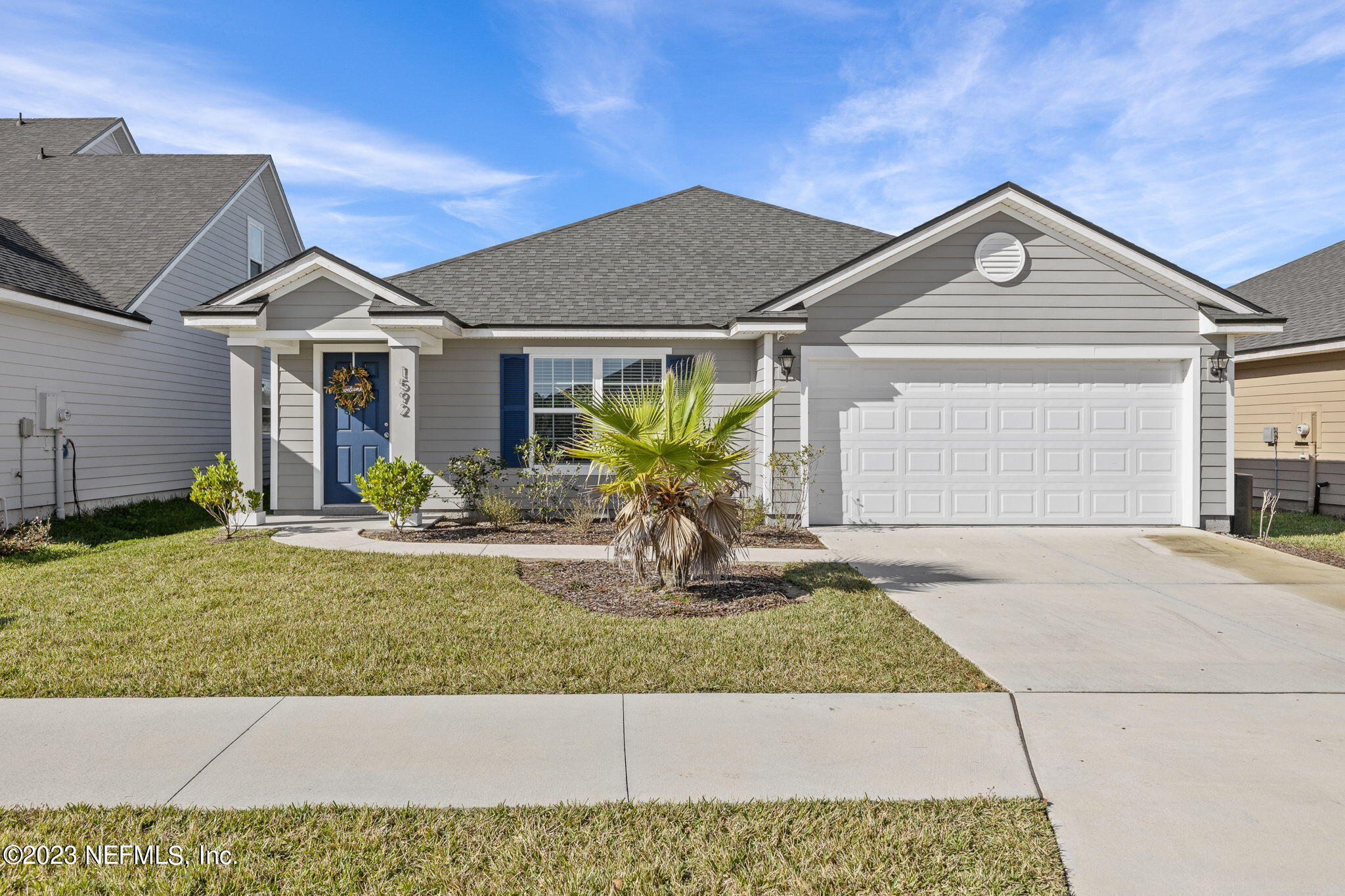 a front view of a house with garden