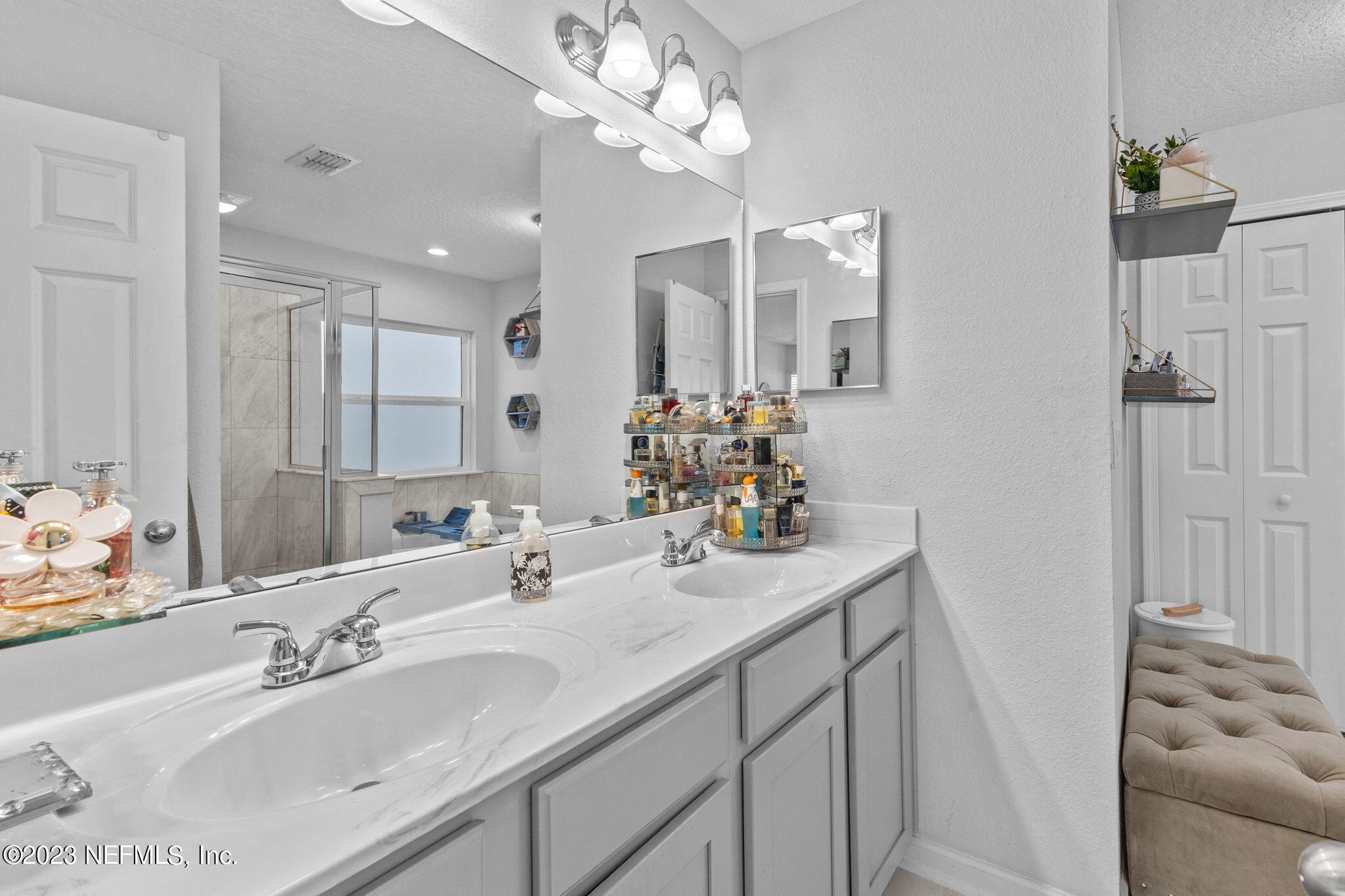 1592 Liberty Tree Place Jacksonville, FL 32221 - Photo 13 of 28 a bathroom with a sink double vanity and a mirror
