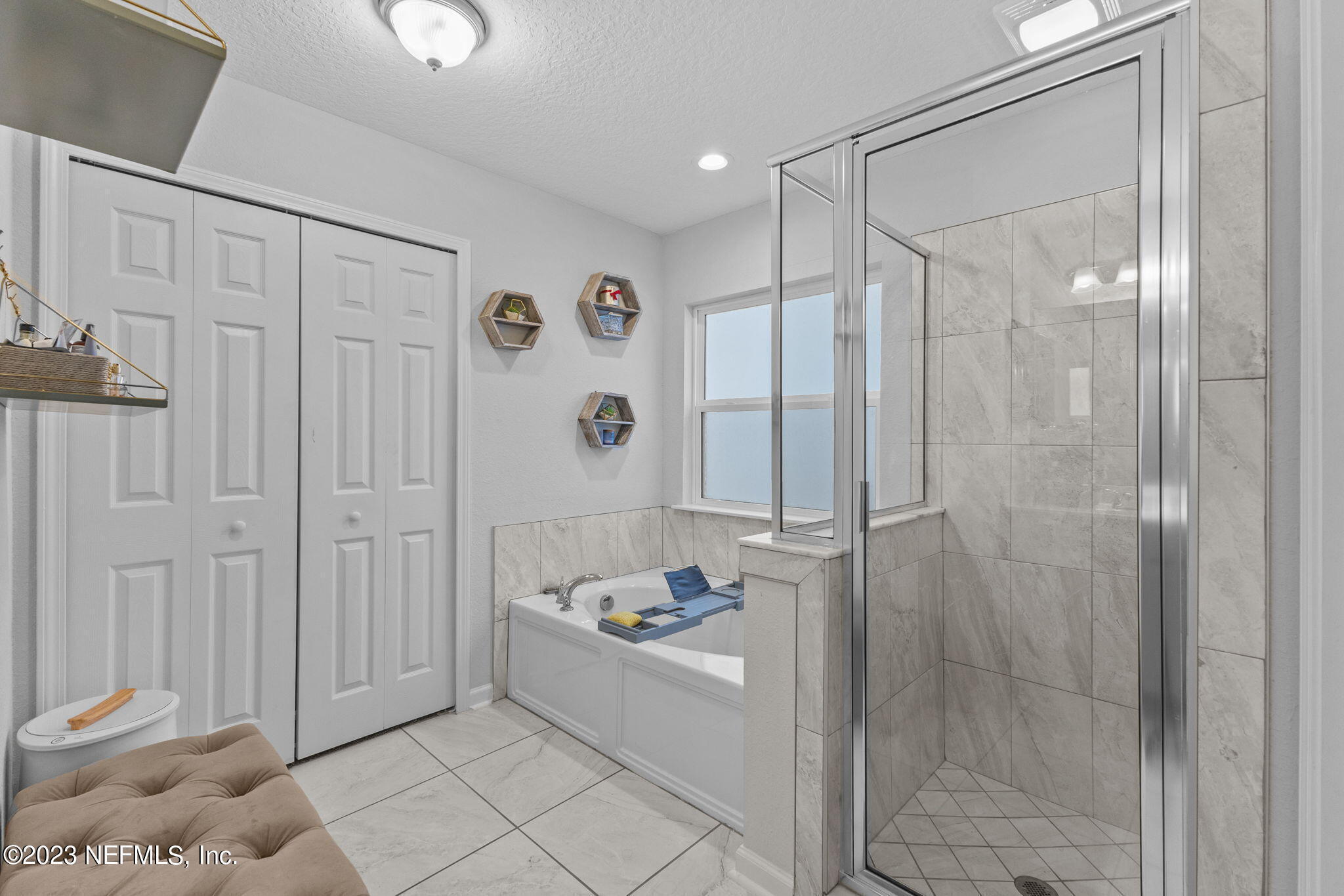 1592 Liberty Tree Place Jacksonville, FL 32221 - Photo 14 of 28 a bathroom with a bathtub and shower