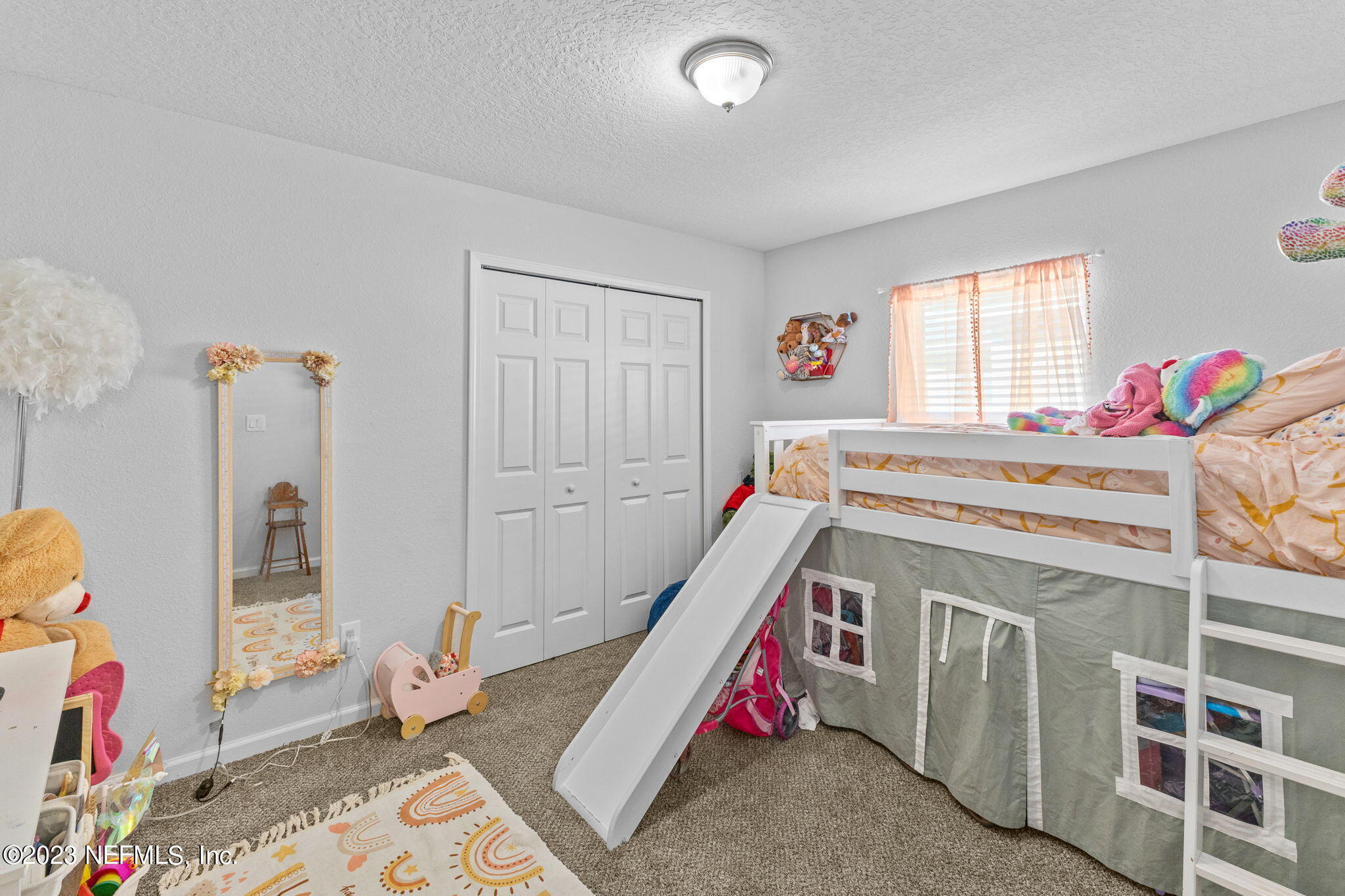 1592 Liberty Tree Place Jacksonville, FL 32221 - Photo 16 of 28 a bedroom with a bed and a window