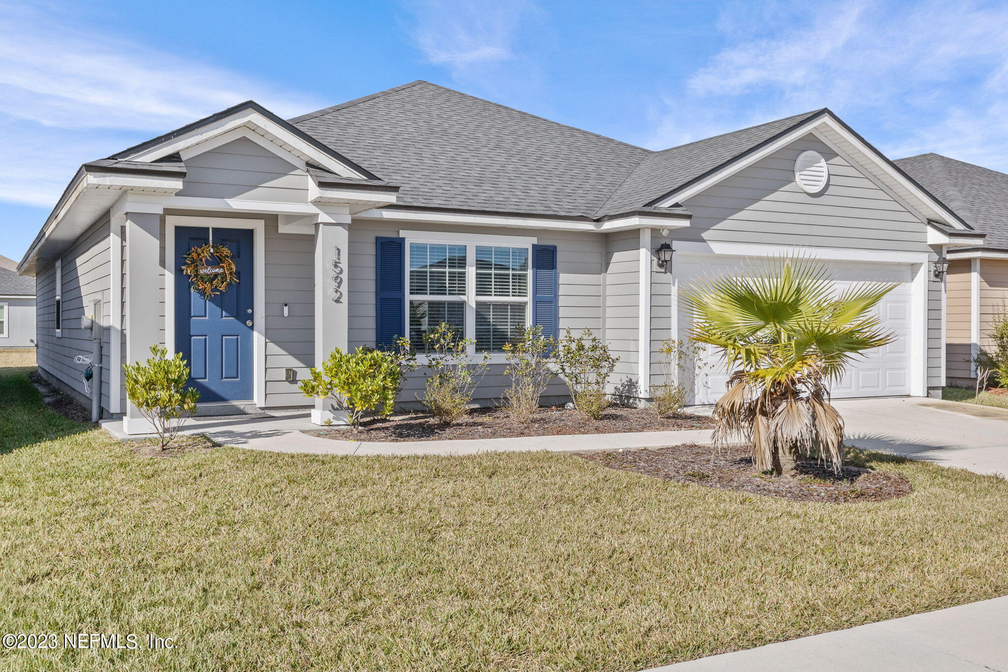 1592 Liberty Tree Place Jacksonville, FL 32221 - Photo 2 of 28 a front view of a house with porch and glass windows