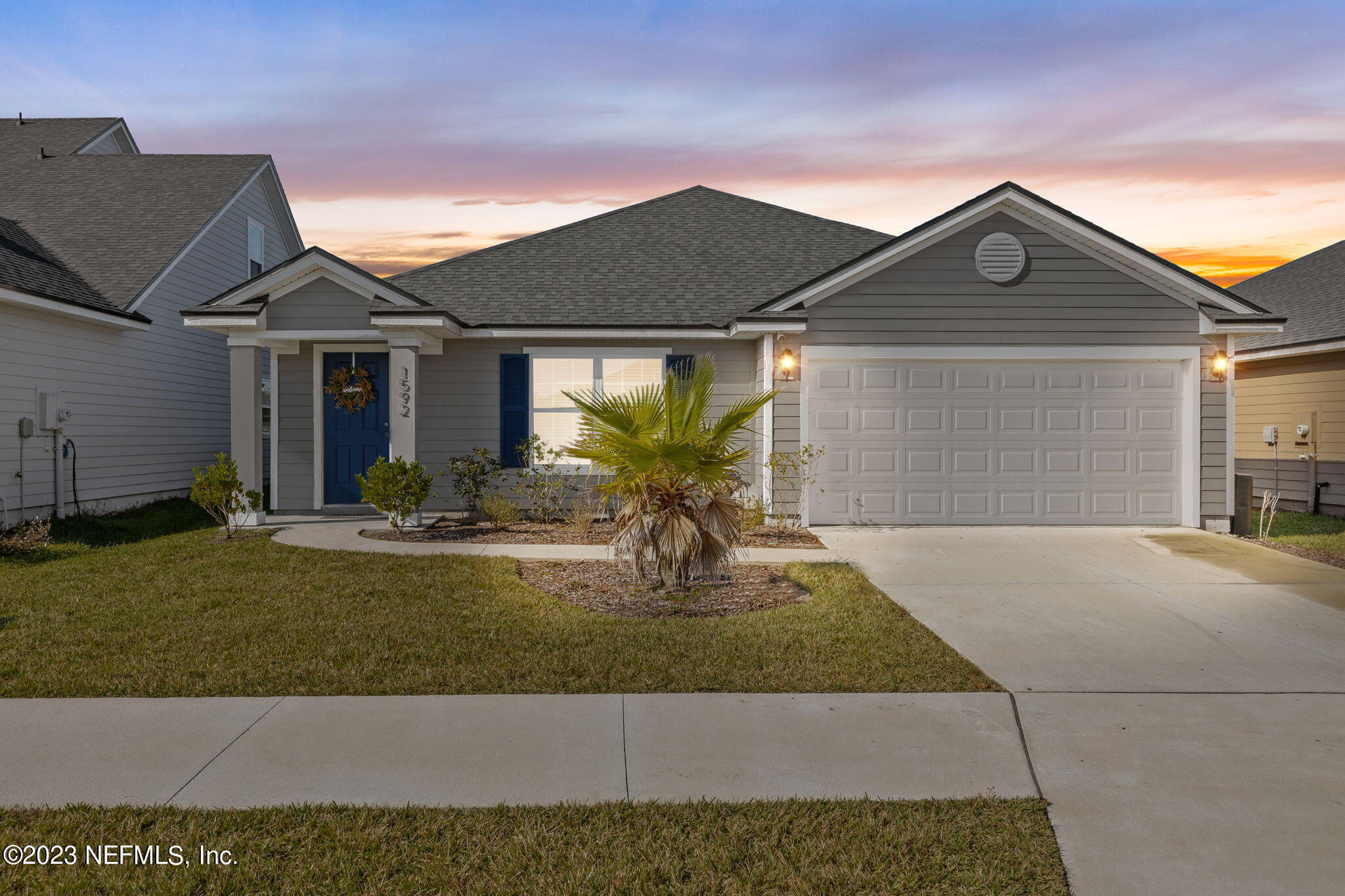 1592 Liberty Tree Place Jacksonville, FL 32221 - Photo 25 of 28 a front view of a house with garden