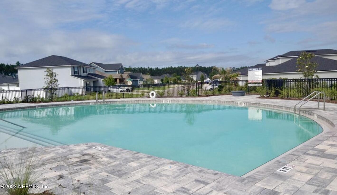 1592 Liberty Tree Place Jacksonville, FL 32221 - Photo 28 of 28 a view of a lake with a house in the background