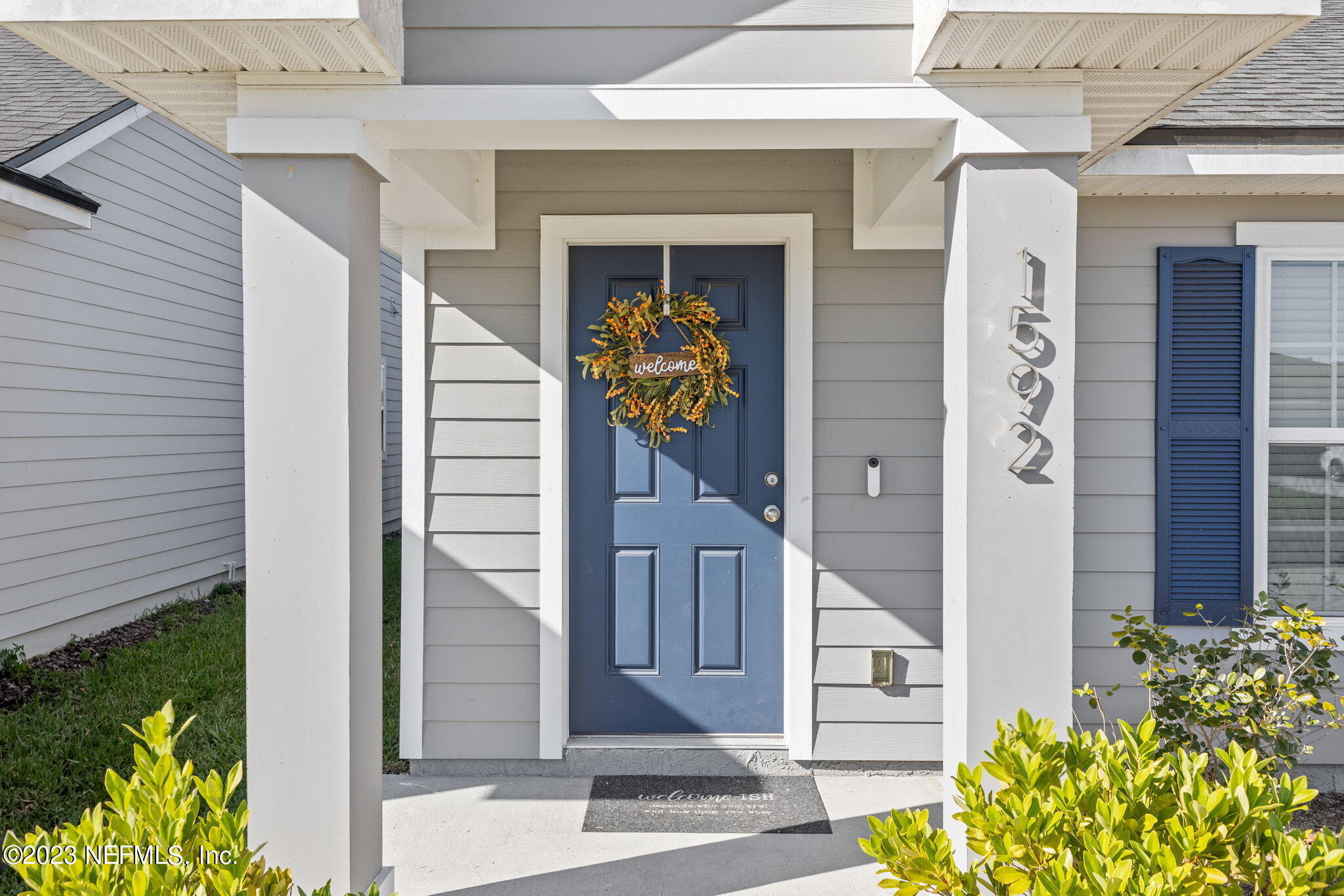 1592 Liberty Tree Place Jacksonville, FL 32221 - Photo 3 of 28 a front view of a house with garden