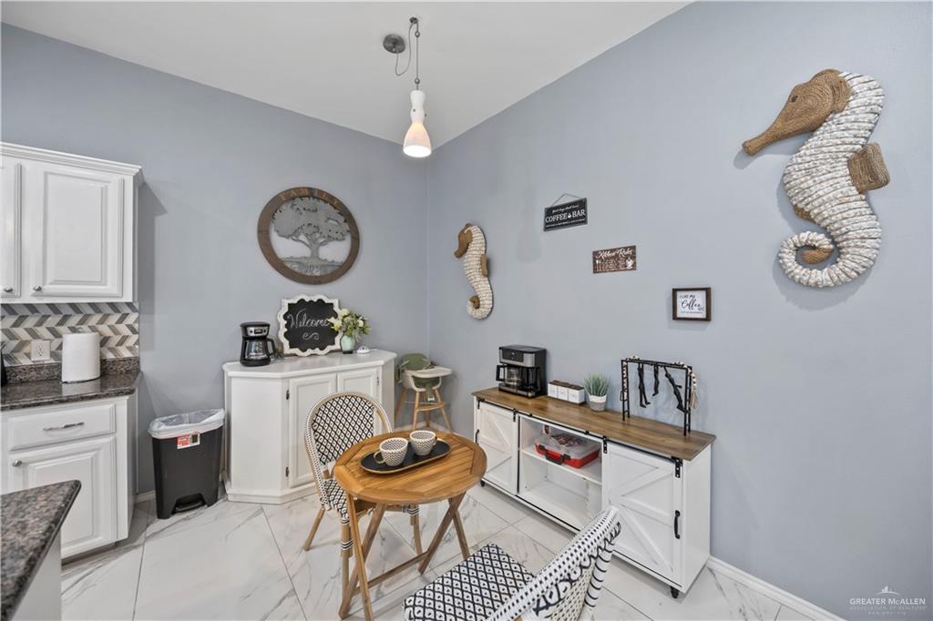 3107 South 6th Lane McAllen, TX 78503 - Photo 11 of 31 a living room with furniture and a clock