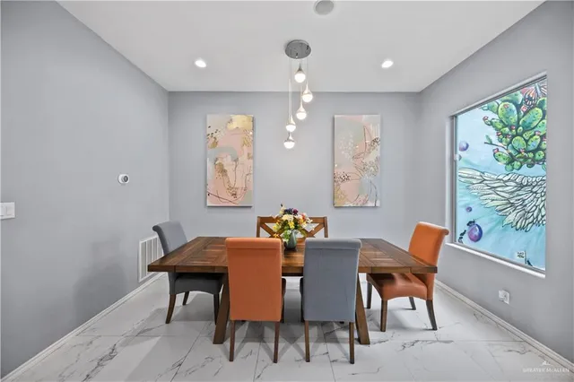 a kitchen with granite countertop a sink a counter top space and living room view