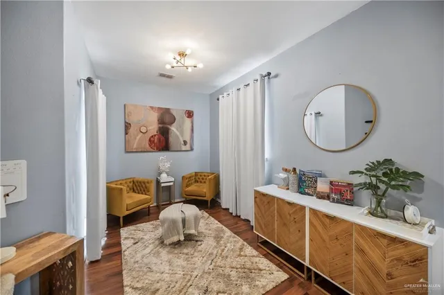 a bathroom with a granite countertop sink a large mirror and a shower