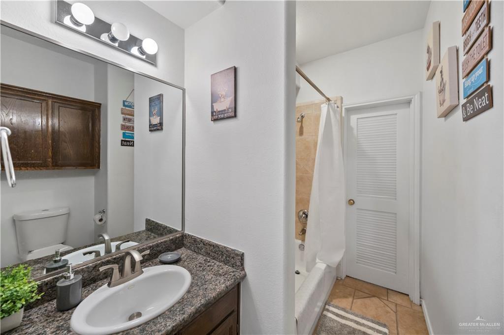 3107 South 6th Lane McAllen, TX 78503 - Photo 20 of 31 a bathroom with a sink double vanity granite tub and shower