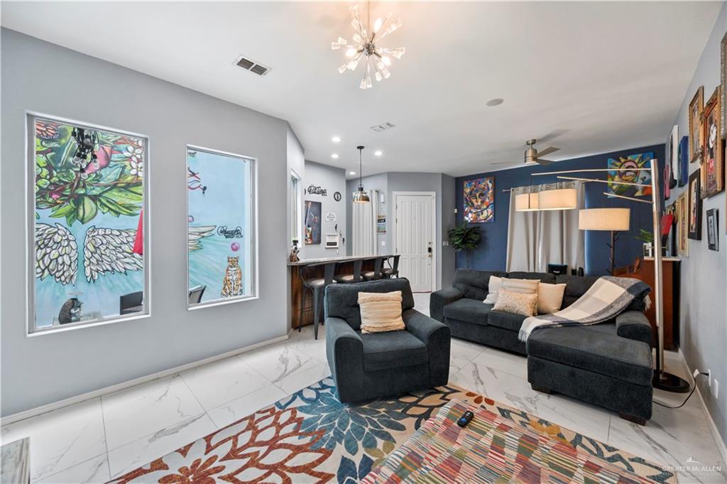 3107 South 6th Lane McAllen, TX 78503 - Photo 7 of 31 a living room with furniture and painting on the wall