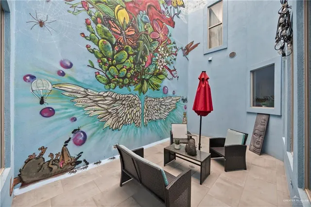 a kitchen with granite countertop stainless steel appliances a stove refrigerator sink and cabinets