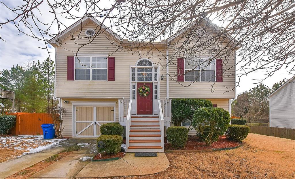4422 Roche Street Atlanta, GA 30349 - Photo 1 of 1 front view of a house with a yard