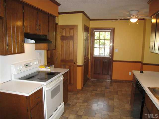 3505 East Jameson Road Raleigh, NC 27604 - Photo 6 of 14 Kitchen. Note exterior side entry door. Pantry adjacent to side entry door