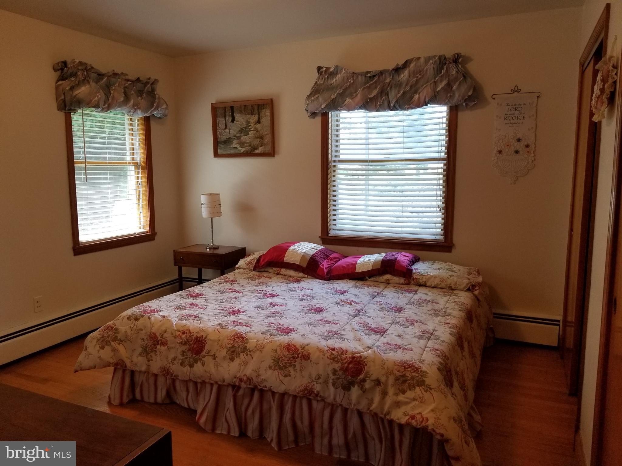 5 Upland Road Fallston, MD 21047 - Photo 6 of 8 a bed sitting in a bedroom next to a window