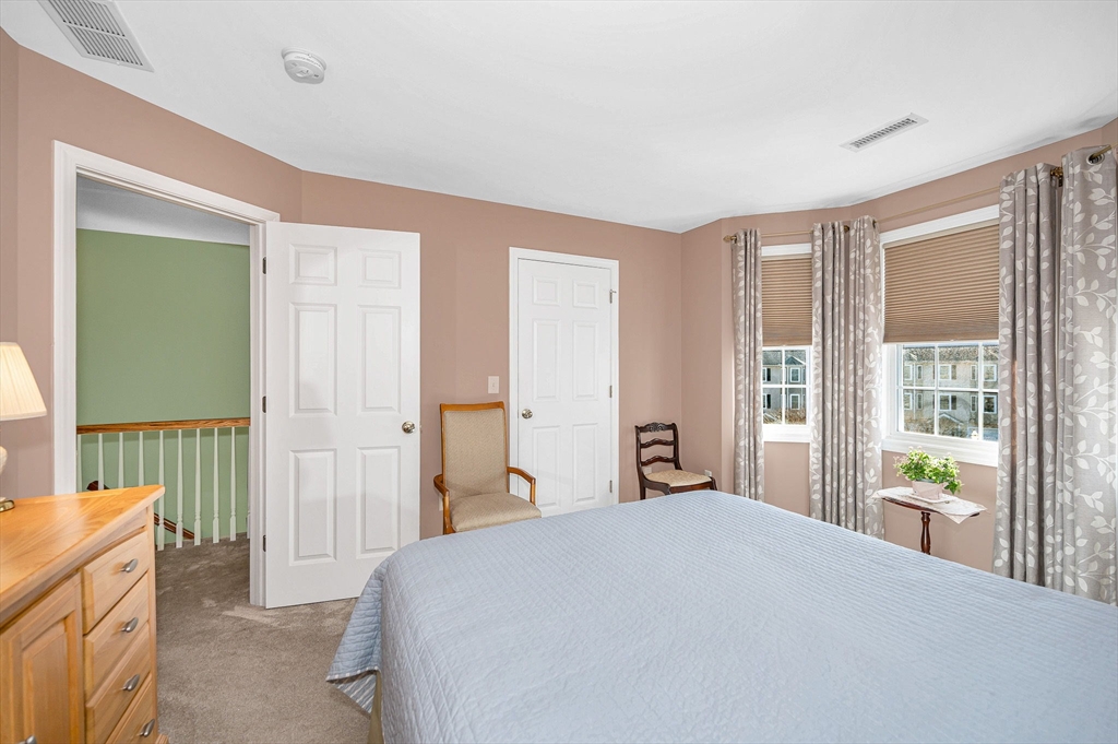 262 Littleton Road, Unit 14 Chelmsford, MA 01824 - Photo 25 of 30 a bedroom with a bed and a window