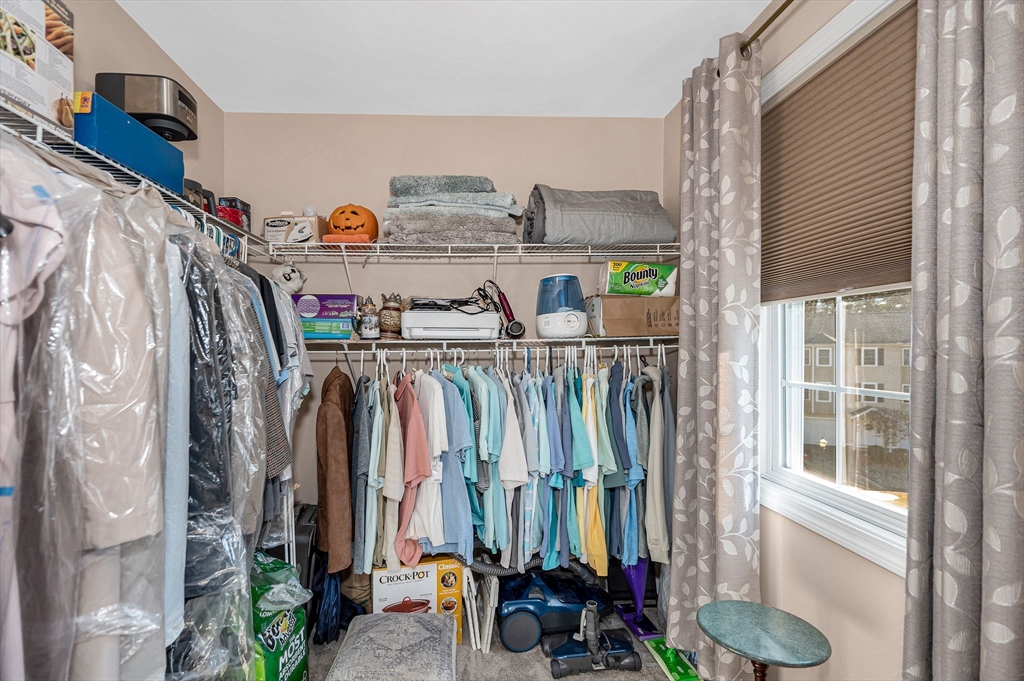 262 Littleton Road, Unit 14 Chelmsford, MA 01824 - Photo 26 of 30 a view of walk in closet with clothes and shoes