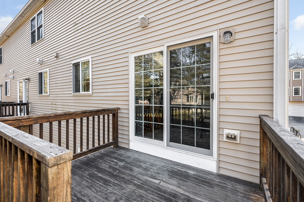262 Littleton Road, Unit 14 Chelmsford, MA 01824 - Photo 27 of 30 a view of backyard with deck