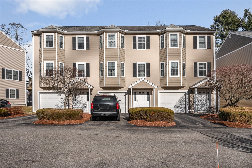 262 Littleton Road, Unit 14 Chelmsford, MA 01824 - Photo 28 of 30 a front view of a house with a yard