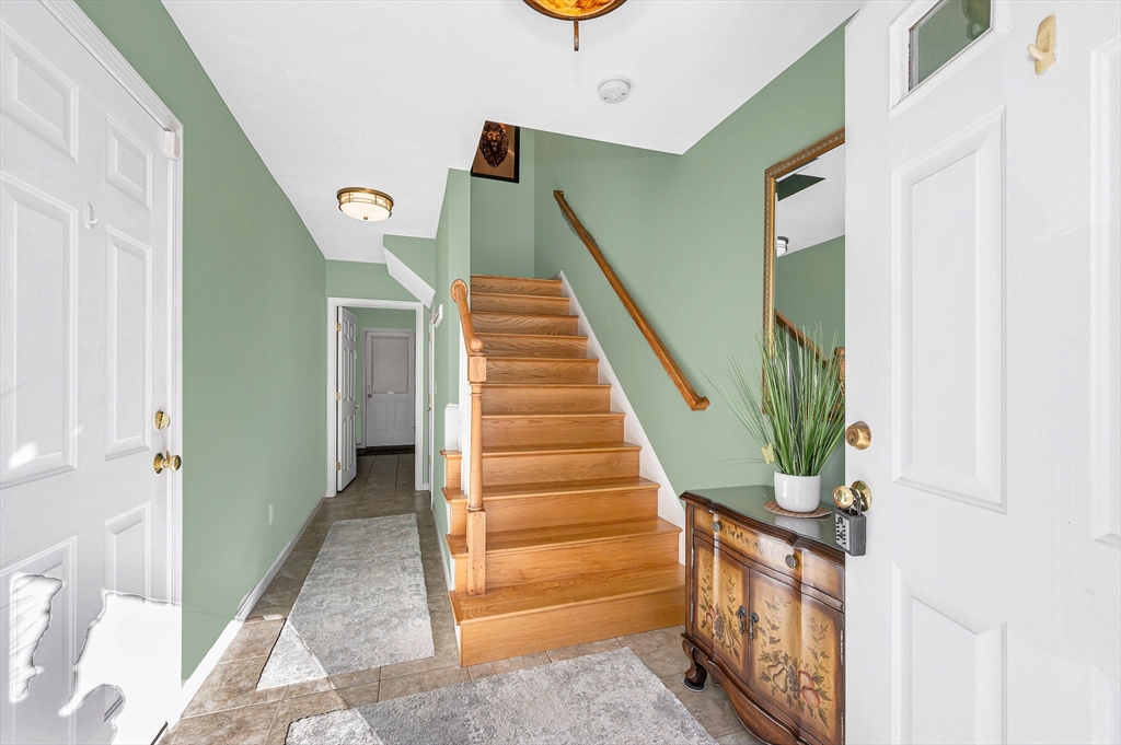262 Littleton Road, Unit 14 Chelmsford, MA 01824 - Photo 3 of 30 a view of entryway with wooden floor and stairs