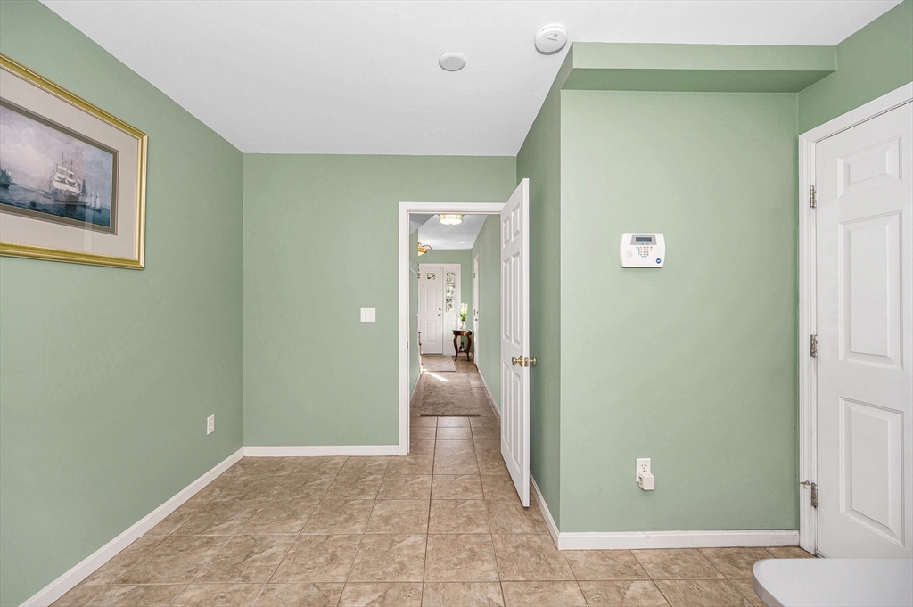 262 Littleton Road, Unit 14 Chelmsford, MA 01824 - Photo 7 of 30 a view of a hallway with wooden shelves