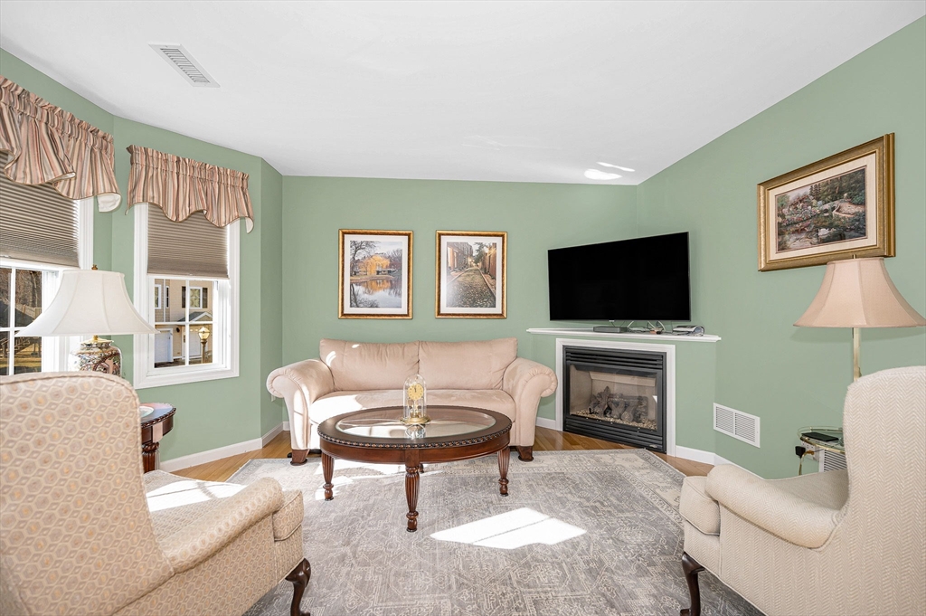 262 Littleton Road, Unit 14 Chelmsford, MA 01824 - Photo 8 of 30 a living room with furniture and a flat screen tv