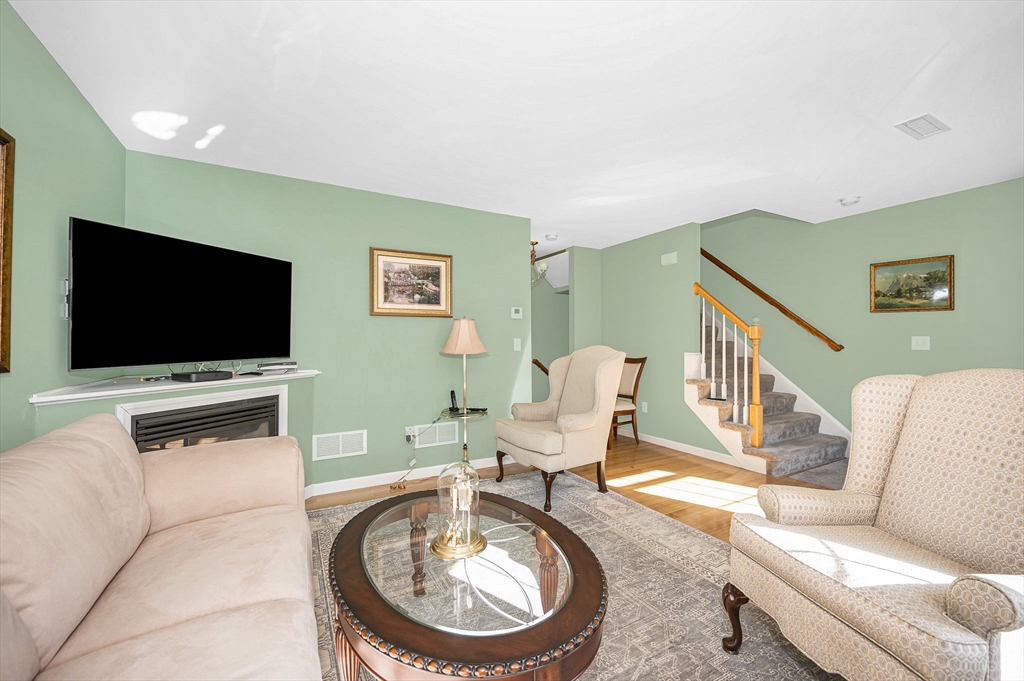 262 Littleton Road, Unit 14 Chelmsford, MA 01824 - Photo 10 of 30 a living room with furniture and a flat screen tv