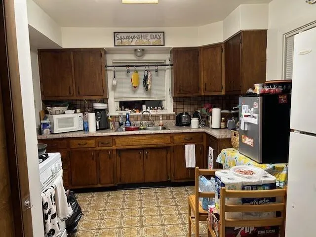 a room with furniture a sink and a window