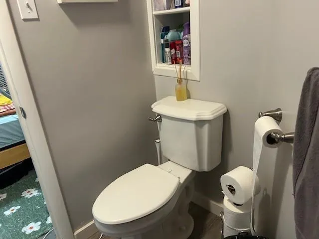 a bathroom with a toilet and a sink
