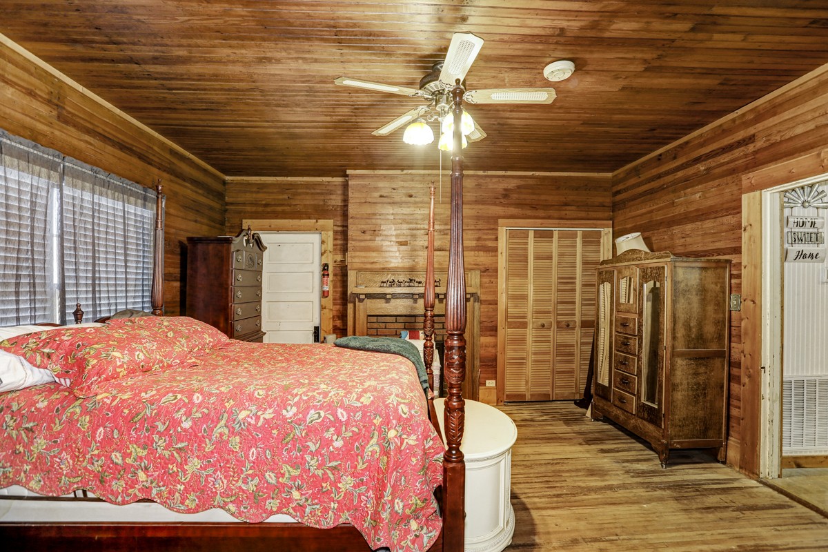 27 Bee Spring Road Dellrose, TN 38453 - Photo 15 of 30 a bedroom with a bed and wooden floor