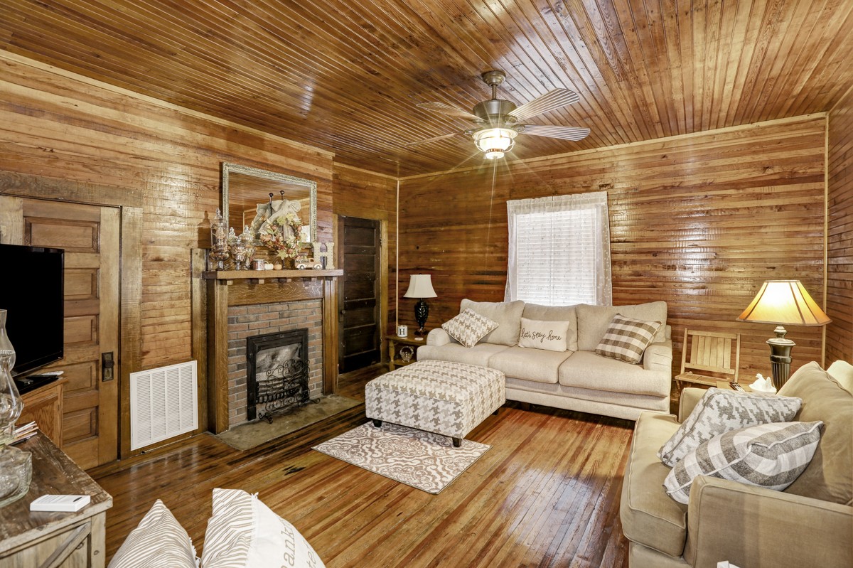 27 Bee Spring Road Dellrose, TN 38453 - Photo 6 of 30 a living room with furniture and a fireplace
