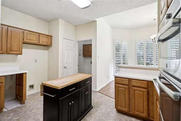 a kitchen with a stove and a sink