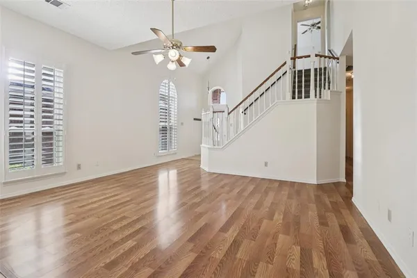 a view of an entryway with wooden floor