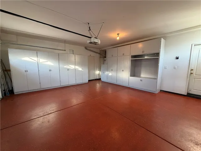 an empty room with a empty space and windows