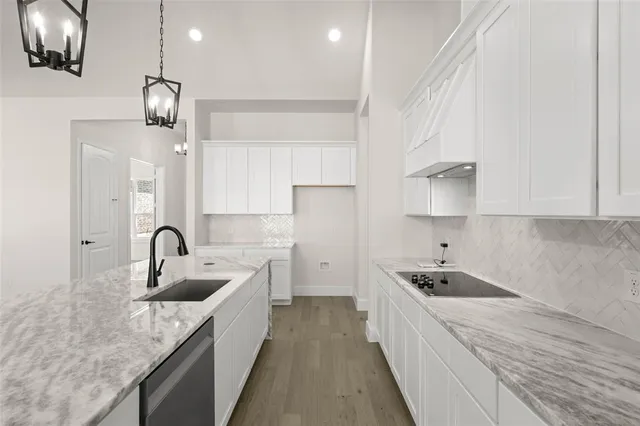 a kitchen with counter top space cabinets and stainless steel appliances