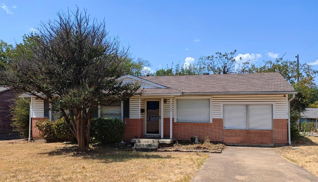 12225 Schroeder Road Dallas, TX 75243 - Photo 4 of 40 Partial brick and siding exterior with a composition shingle roof