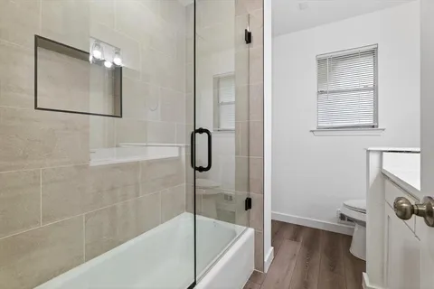a bathroom with a bathtub and a shower