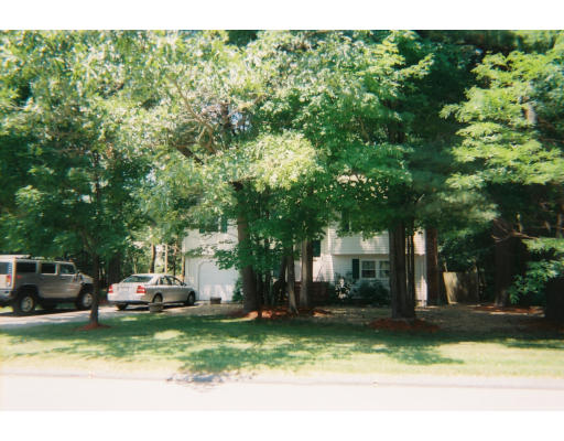 18 Rickey Drive Maynard, MA 01754 - Photo 3 of 9 a front view of a house with a yard
