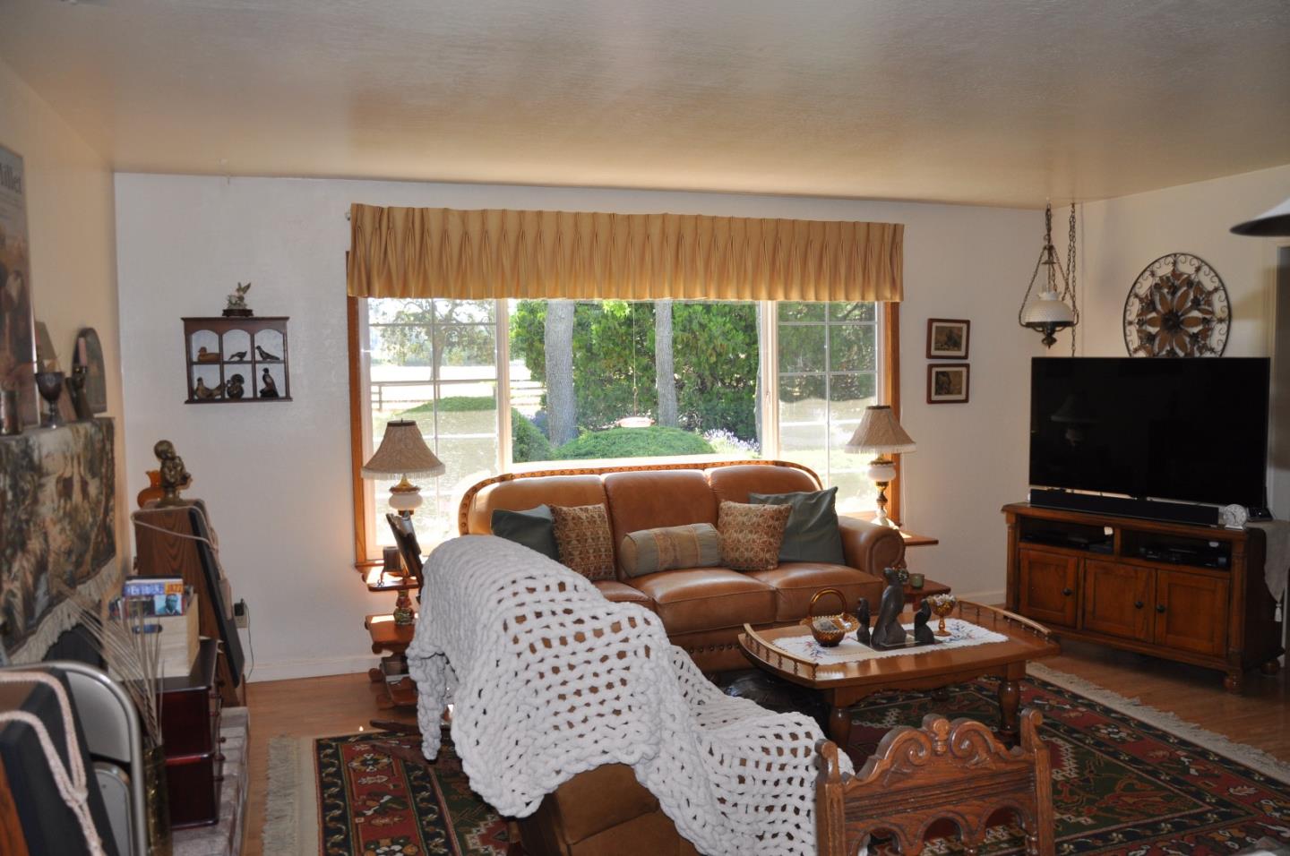 8835 Burchell Road Gilroy, CA 95020 - Photo 5 of 17 a living room with furniture and a flat screen tv