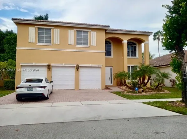 a car parked in front of a house