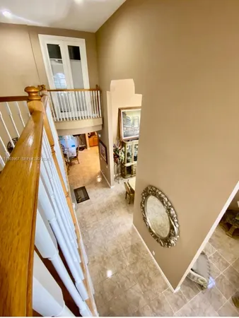 a view of a livingroom with furniture and entryway