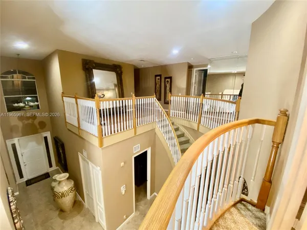 a view of an entryway with wooden floor