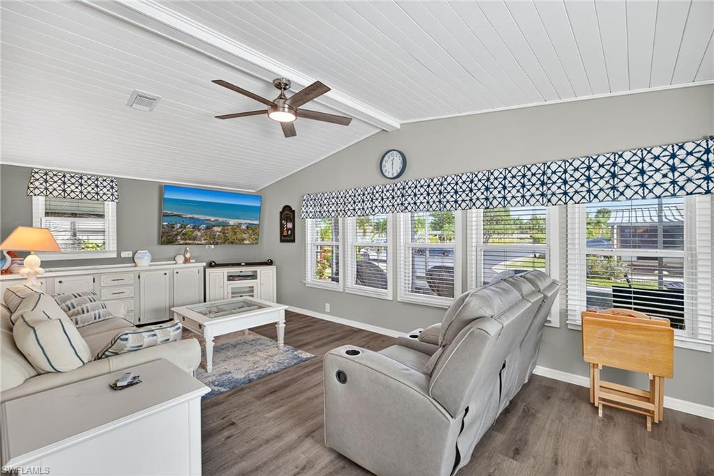 170 Oceans Boulevard, Unit 170 Naples, FL 34104 - Photo 1 of 36 a living room with furniture and a large window